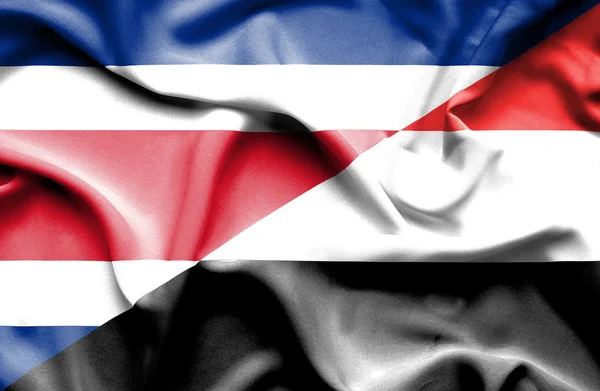 Flagge von Jemen und Costa Rica schwenken — Stockfoto