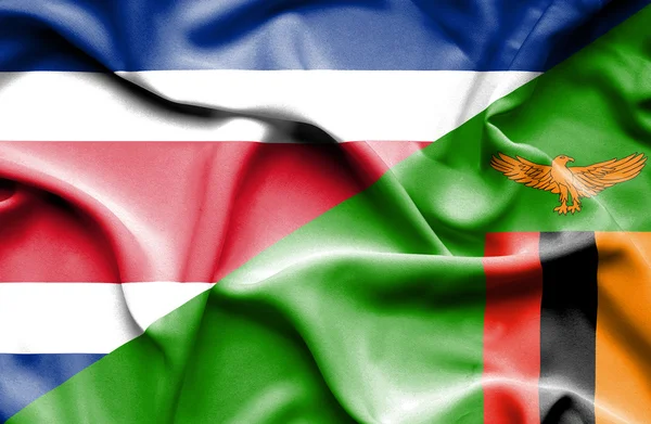 Waving flag of Zimbabwe and Costa Rica — Stock Photo, Image