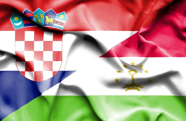 Развевающийся флаг Таджикистана и Хорватии — стоковое фото