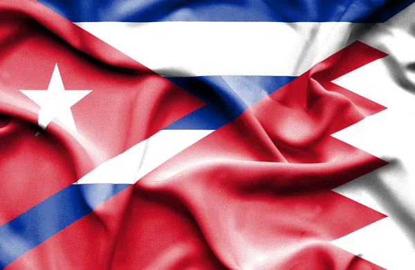 Fahne von Bahrain und Kuba schwenken — Stockfoto