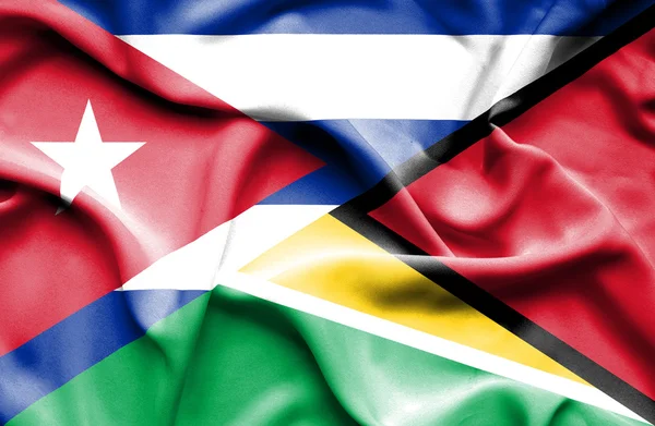 Waving flag of Guyana and Cuba — Stock Photo, Image