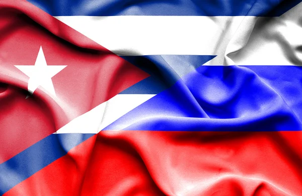 Waving flag of Russia and Cuba — Stock Photo, Image