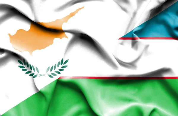 Waving flag of Uzbekistan and Cyprus — Stock Photo, Image