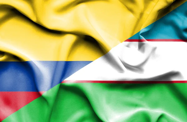 Bandeira acenando de Uzbequistão e Columbia — Fotografia de Stock