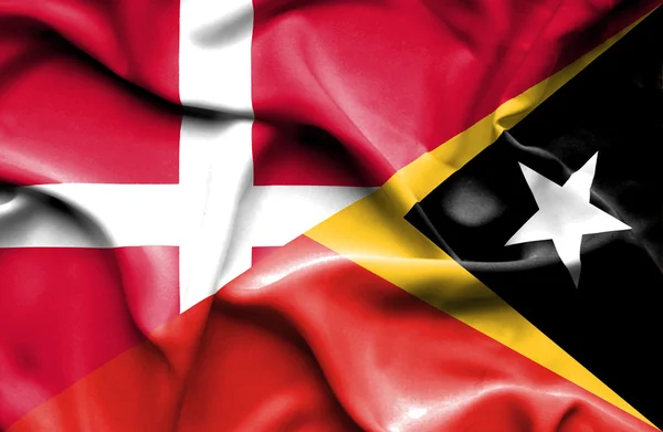 Machać flaga Timoru Wschodniego i dania — Zdjęcie stockowe