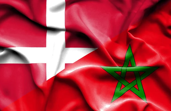 Wapperende vlag van Marokko en Denemarken — Stockfoto