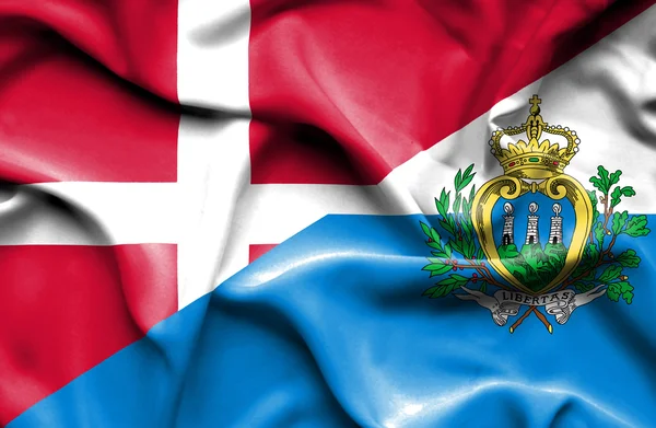 Viftande flagga Danmark och San Marino — Stockfoto