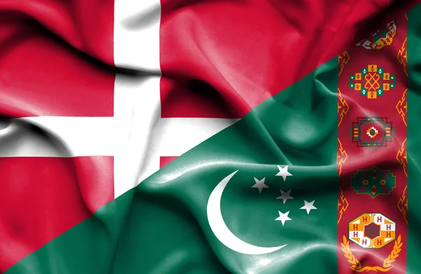 Bandeira ondulada do Turquemenistão e Dinamarca — Fotografia de Stock