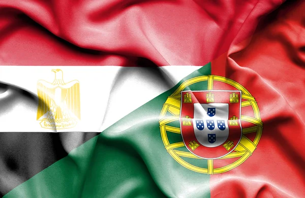 Waving flag of Portugal and Egypt — Stock Photo, Image