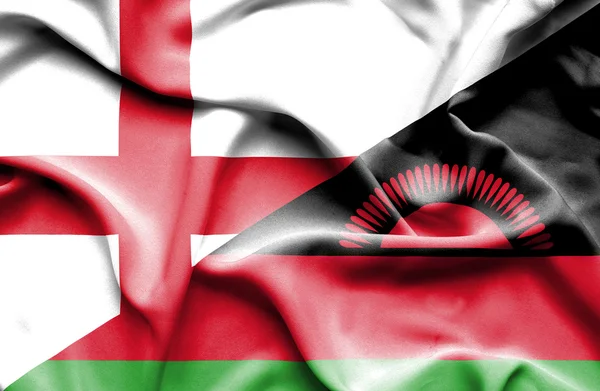 Ondeando la bandera de Malawi e Inglaterra —  Fotos de Stock