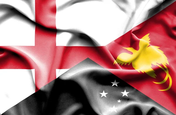 Vlající vlajka Papuy-Nové Guineje a Anglie — Stock fotografie