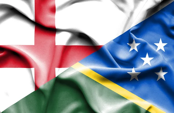 Waving flag of Solomon Islands and England — Stock Photo, Image