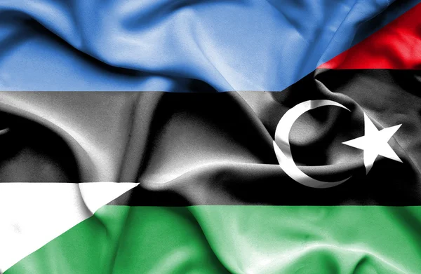Vlající vlajka Libye a Estonsko — Stock fotografie