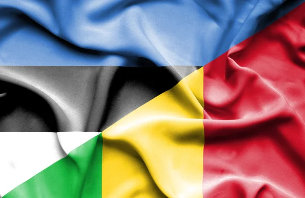 Waving flag of Mali and Estonia — Stock Photo, Image