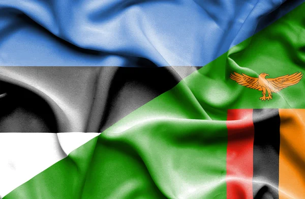 Bandeira ondulada do Zimbabué e da Estónia — Fotografia de Stock