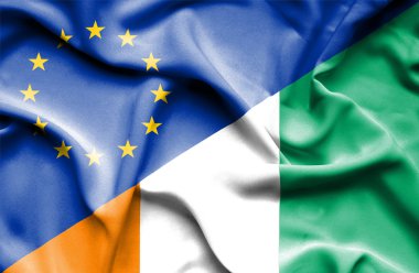 Fildişi Sahili ve AB bayrağı sallayarak