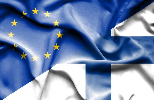 Macha flagą Finlandii i UE — Zdjęcie stockowe
