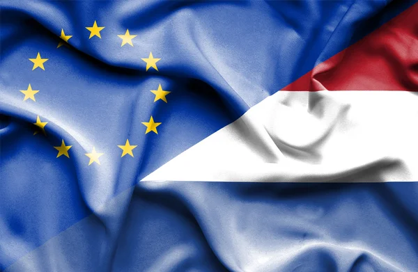 Waving flag of Netherlands and EU — Stock Photo, Image