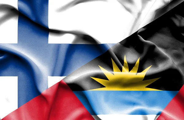 Wapperende vlag van Antigua en Barbuda en Finland — Stockfoto