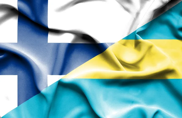 Fahne von Bahamas und Finnland schwenken — Stockfoto