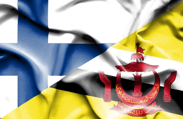 Flagge von Brunei und Finnland schwenken — Stockfoto