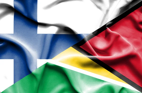 Bandera ondeante de Guyana y Finlandia — Foto de Stock