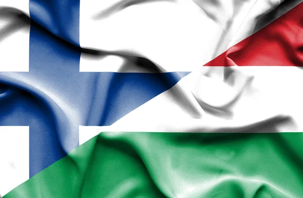 Waving flag of Hungary and Finland — Stock Photo, Image