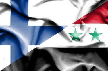 Suriye ve Finlandiya bayrağı sallayarak