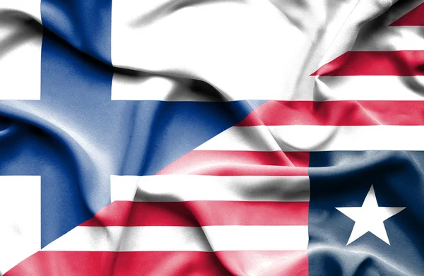 Wapperende vlag van Liberia en Finland — Stockfoto