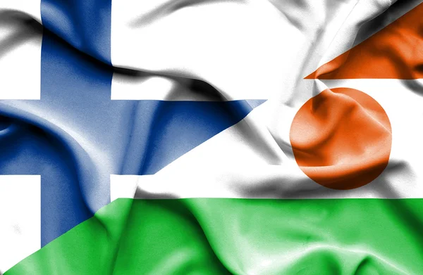 Bandeira ondulada do Níger e da Finlândia — Fotografia de Stock