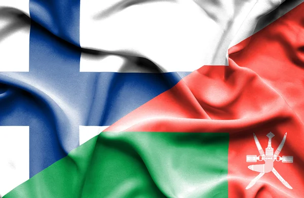 Waving flag of Oman and Finland — Stock Photo, Image