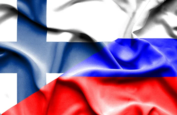 Vlající vlajka Ruska a Finska — Stock fotografie