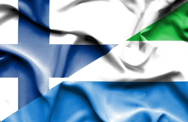 Waving flag of Sierra Leone and Finland — Stock Photo, Image