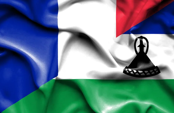 Bandeira acenando de Lesoto e França — Fotografia de Stock