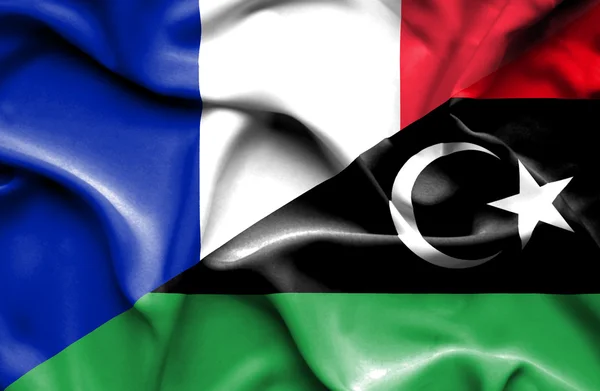 Waving flag of Libya and France — Stock Photo, Image
