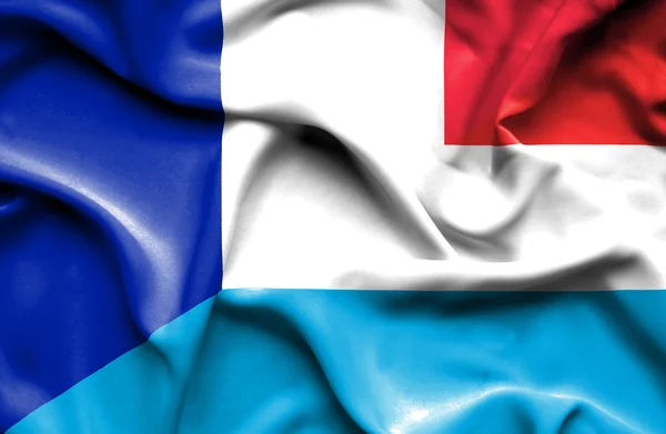 Luxemburg och Frankrike viftande flagga — Stockfoto