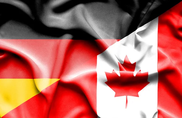 Waving flag of Canada and Germany — Stock Photo, Image