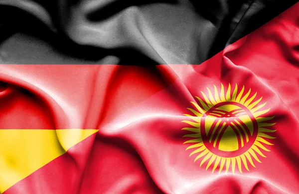 Waving flag of Kyrgyzstan and Germany — Stock Photo, Image