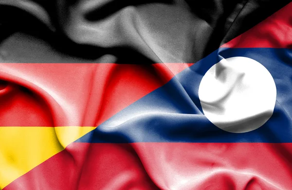 老挝和德国那飘扬的旗帜 — 图库照片