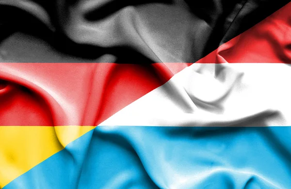 Waving flag of Luxembourg and Germany — Stock Photo, Image