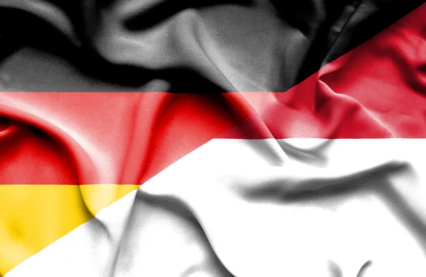 Waving flag of Monaco and Germany — Stock Photo, Image