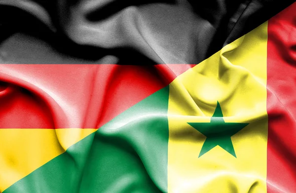 Waving flag of Senegal and Germany — Stock Photo, Image