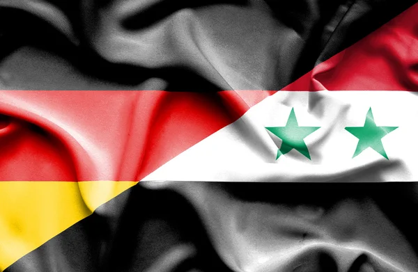 Waving flag of Syria and Germany — Stock Photo, Image