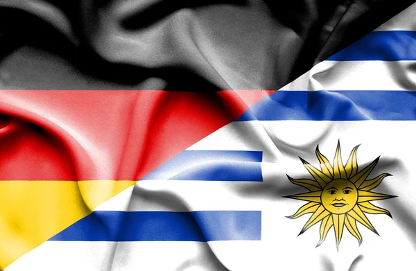 Waving flag of Uruguay and Germany — Stock Photo, Image