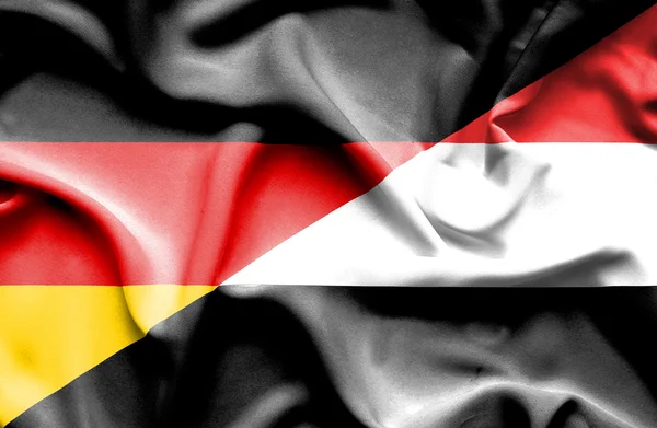Mávání vlajkou Jemenu a Německo — Stock fotografie