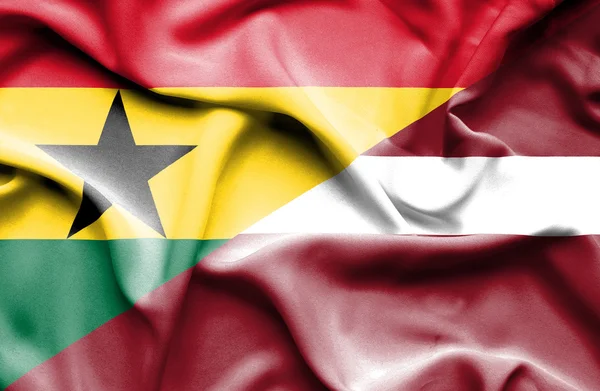 Lettland och Ghana viftande flagga — Stockfoto