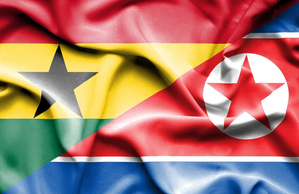 Flagge Nordkoreas und Ghanas schwenken — Stockfoto