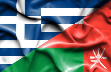 Umman ve Yunanistan bayrağı sallayarak