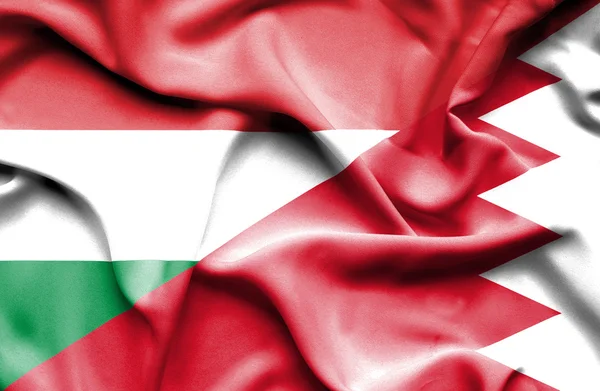 Waving flag of Bahrain and Hungary — Stock Photo, Image