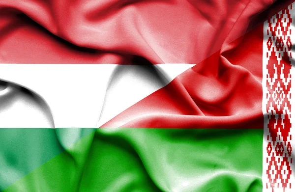 Vlající vlajka Běloruska a Maďarsko — Stock fotografie